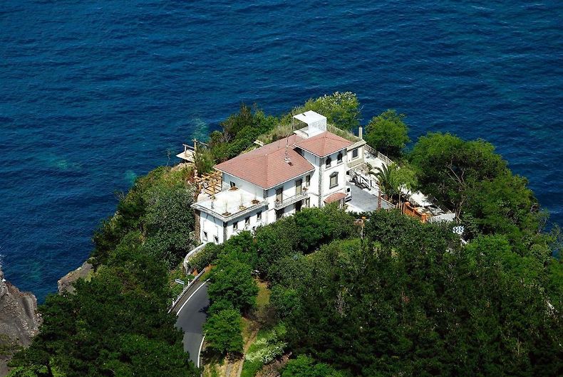Aerial view of Villa Alkolea perched on the cliff above the Cantabrian Sea